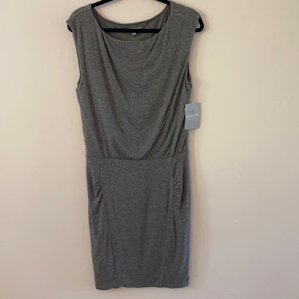 Athleta dress brand new with tags still attached. Gray color size small.